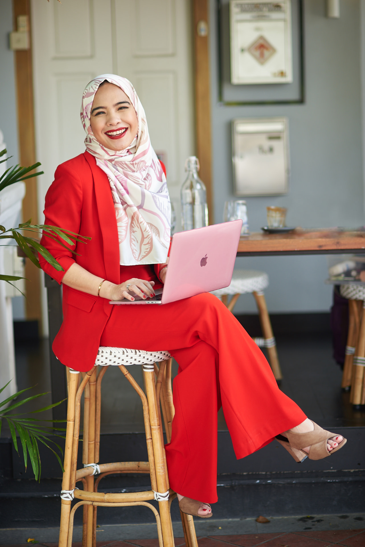 Bella Khaja working on her laptop